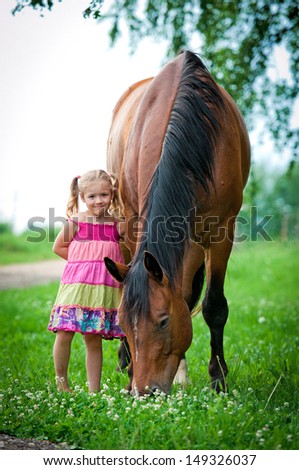 Little girl with big horse
