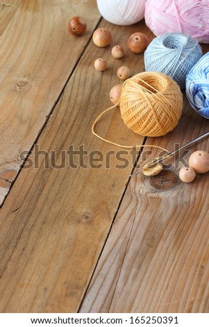 Materials for needlework on wooden rustic table