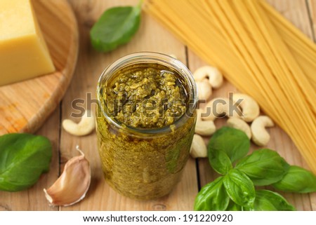 Traditional italian pesto sauce with green basil and parmesan cheese