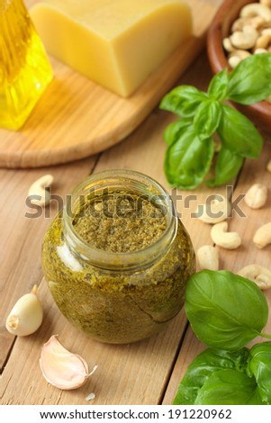 Traditional italian pesto sauce with green basil and parmesan cheese