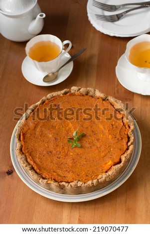 Traditional American and Canadian pumpkin pie for Thanksgiving day. Healthy vegan pie with whole-wheat flour