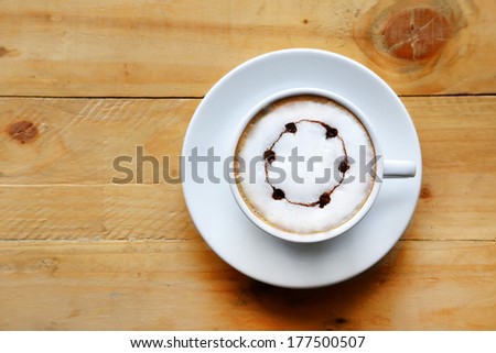 A cup of coffee white cup on wooden background.