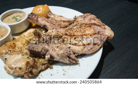 Pork chop and chicken with gravy