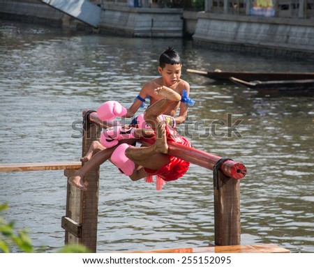 BANGKOK, THAILAND - FEB. 14 :traditional water Thai boxing (or Muay Talay) - ancient Thai fight above the water - at Bangkok floating market, Thailand on February 14, 2015.