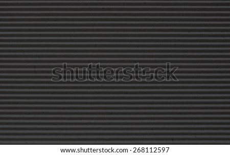 black corrugated paper background.