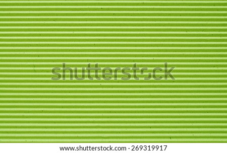 green corrugated paper background.
