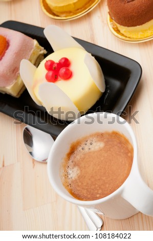 espresso coffee and  fruit cream cake pastry closeup