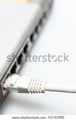 network hub switch with lan cable connected over white