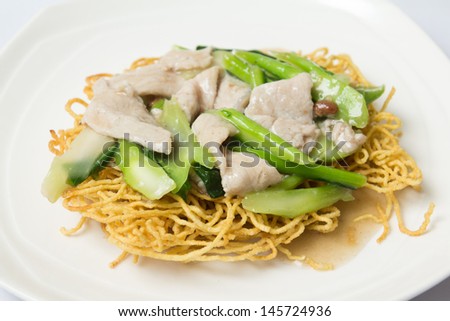 crispy fried noodle with pork and kale soaked in gravy