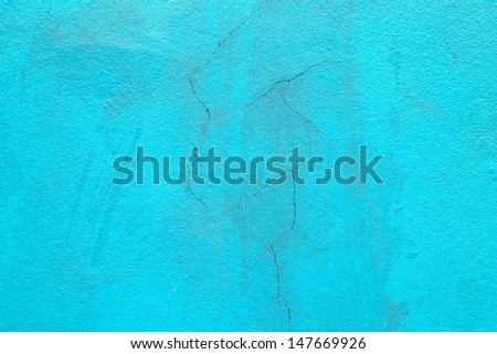 Texture of fracture on blue concrete wall