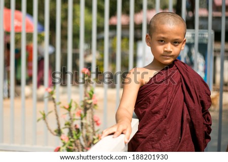 MANDALAY - MYANMAR - FEBRUARY 27 : Unidentified Burmese Buddhist Novice on February 27, 2014 in Mandalay, Myanmar. In 2012 an ongoing conflict started between Buddhists and Muslims in Myanmar.