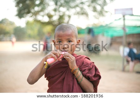 MANDALAY - MYANMAR - FEBRUARY 26 : Unidentified Burmese Buddhist Novice on February 26, 2014 in Mandalay, Myanmar. In 2012 an ongoing conflict started between Buddhists and Muslims in Myanmar.