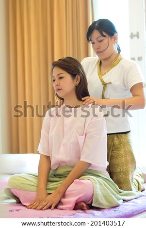 SURATTHANI, THAILAND- MAY 5: Unknown woman massaging with traditional Thai massage techniques on May 5, 2012 in Suratthani, Thailand. It is a system of massage and manipulation developed in Thailand.