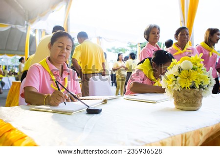 SURATTHANI, THAILAND - DECEMBER 5 : Unidentified people sign get-well messages for HM King Bhumibol on December 5, 2014 in Suratthani, Thailand. King Bhumibol is respected and revered by most Thais.