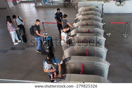 BANGKOK, THAILAND-MARCH 16: Unknown people walks pass the gate of Suvarnabhumi Airport Rail Link Station on March 16, 2015 in Bangkok, Thailand. Airport Rail Link opened for service on 23 August 2010.