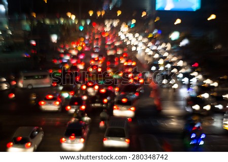 Busy Thoroughfare during rush hour in Bangkok, Thailand. Blurred Background. (zoom blur technique)