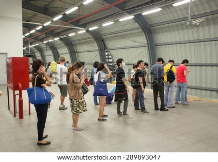 BANGKOK, THAILAND - JUNE 6 : Unidentified passengers waits for the Suvarnabhumi Airport Rail Link Train on June 6, 2015 in Bangkok, Thailand. Airport Rail Link opened for service on 23 August 2010.