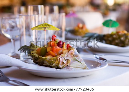 stock photo Fruit salad appetizer served in half pineapple at wedding 
