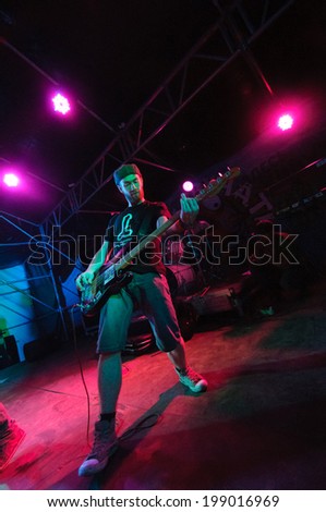 SAMARA, RUSSIA - JULY 27: alternative rock pop band musician playing a guitar on stage at musical festival Time To Sound on river Volga on July 27, 2013 in Samara, Russia