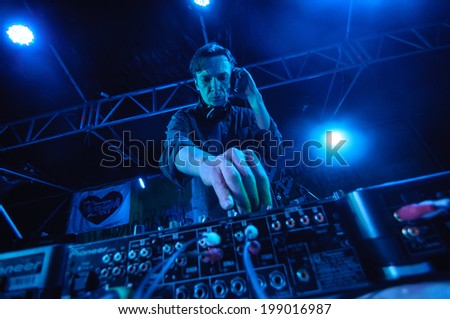 SAMARA, RUSSIA - JULY 27: Dj playing disco house progressive electro music on stage at musical festival Time To Sound on river Volga on July 27, 2013 in Samara, Russia