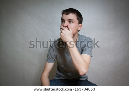Young man with fear and surprised expression in face