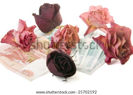 There are dry buds of roses on the russian money