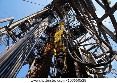Top Drive System (TDS) and Derrick of Oil Drilling Rig