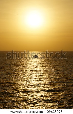 Offshore Crew Boat for Crew Change Before Sunset With Stunning Golden Sky