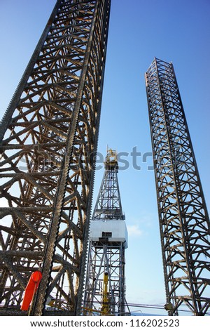 Offshore Jack Up Oil Drilling Rig Raises Rig Legs While Rig Move Operation