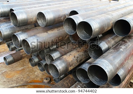 Stack of oilfield casing laying on the deck before running in the oil well