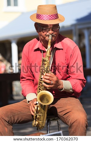 Cape Town,South Africa- October,15: Old Man Saxophone Player At Waterfront Performing Local Music In Jazz Tone On October 15, 2013 In Cape Town, South Africa.