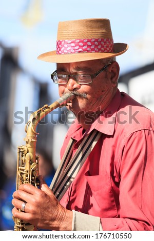CAPE TOWN,SOUTH AFRICA-OCTOBER, 15: Old man saxophone player at Waterfront performing local music in jazz tone on October 15, 2013 in Cape Town, South Africa.