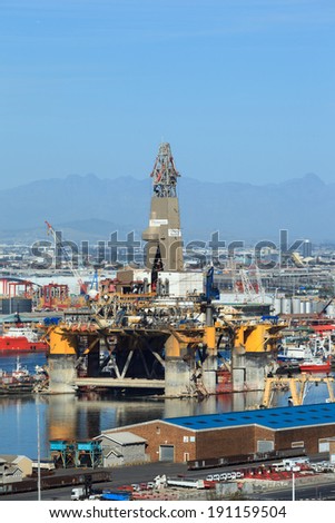 CAPE TOWN, SOUTH AFRICA-OCTOBER, 14: Semi Submersible drilling rig parked in the middle of the shipyard in downtown of Cape Town to get maintenance on October 14, 2013 in Cape Town, South Africa.