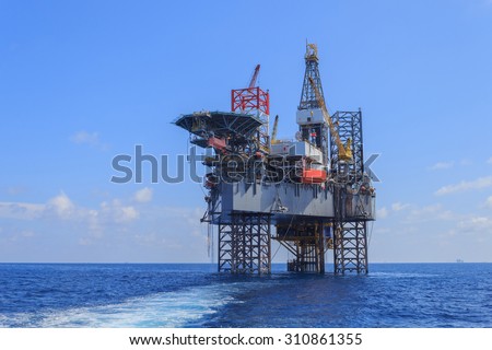 Offshore Jack Up Drilling Rig Over The Production Platform in The Middle of The Sea