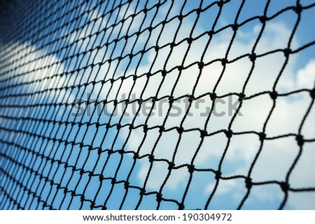 a net is covering the blue sky