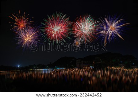 Firework in celebration night with light water reflex (long live the King Rama nine  Birthday Anniversary, 5th December)