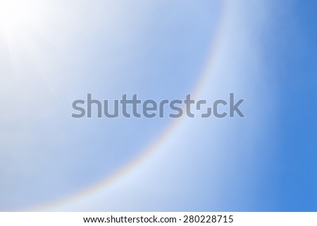 Sun Halo or Rainbow ring on  blue sky and cloud with Contrail