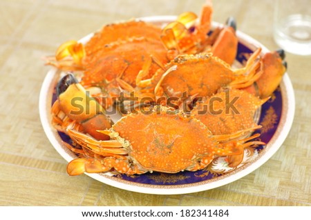 Boiled crabs in the blue dish