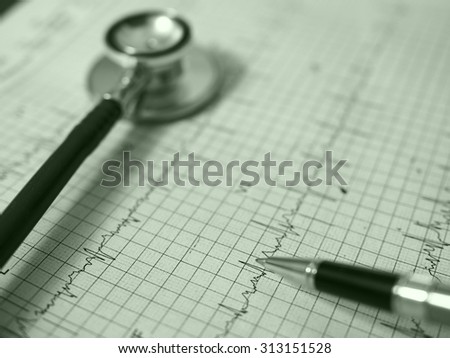 stethoscope and electrocardiogram graph ekg heart rhythm, medicine concept