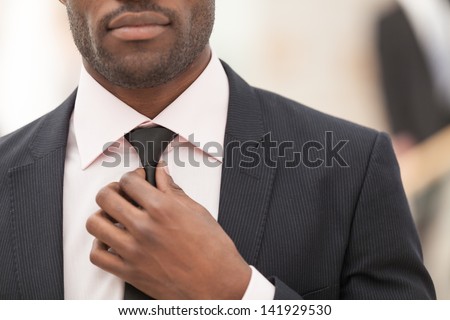 business man touching his tie. Close up