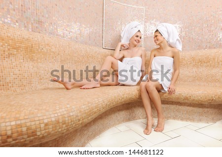 Two attractive girl friends in Turkish sauna