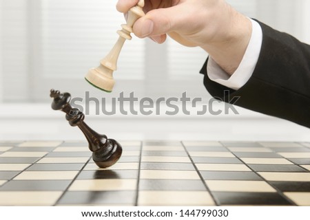High Key Image Of A Chess Board. Checkmate By The Black Pawn.