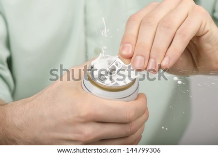 Hands opening a soda (beer) can. Close up