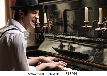 Heã?Â¯Ã?Â¿Ã?Â½ Got Creative Soul. Handsome Young Men Playing Piano And Singing