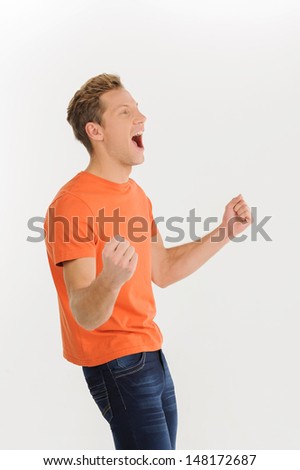 Happy men. Excited young men gesturing while isolated on white