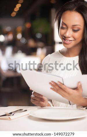 Woman with digital tablet. Attractive African descent women working on digital tablet