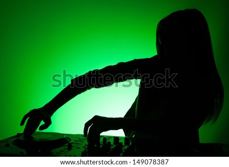 DJ silhouette. Female DJ silhouette isolated on green