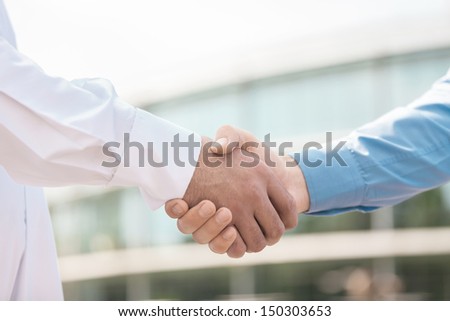 Handshaking. Close-up of handshaking outdoors