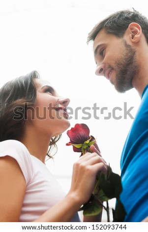 Loving couple. Beautiful loving couple standing face to face and smiling