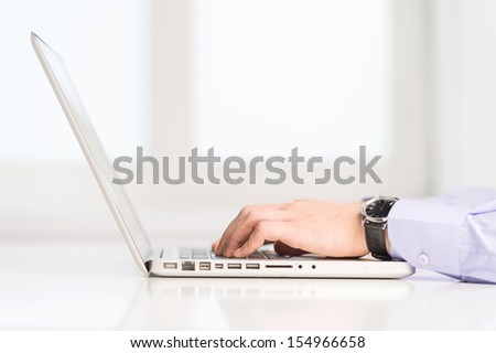 Computer work. Close-up of man typing something on computer